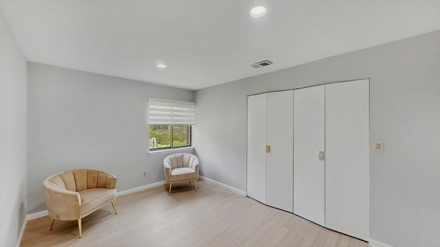 14 Acorn Ponds Dr Unit 14, Roslyn, NY 11576 - sitting room with light wood finished floors, recessed lighting, and baseboards
