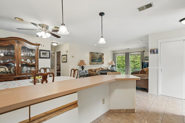 34 Overlook Commons, Yorktown Heights, NY 10598 - kitchen featuring light tile patterned floors, decorative light fixtures, light countertops, a ceiling fan, and open floor plan