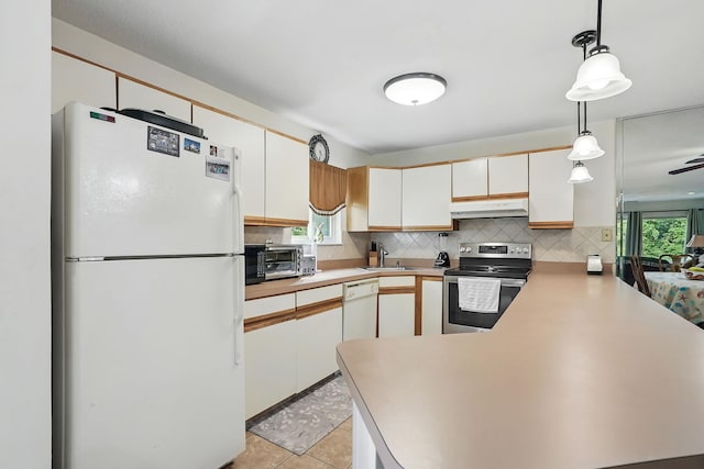 34 Overlook Commons, Yorktown Heights, NY 10598 - kitchen with white appliances, under cabinet range hood, a peninsula, and backsplash