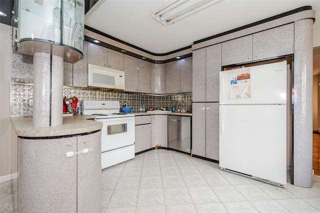 3929 Greentree Dr, Oceanside, NY 11572 - kitchen featuring white appliances, light countertops, and backsplash