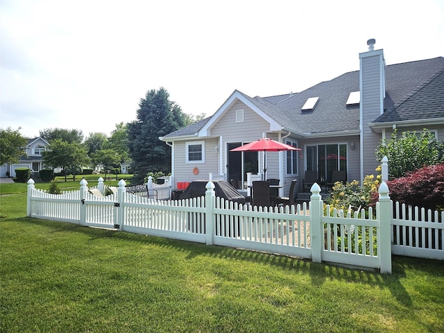 107 Scenic Lake Dr Unit 107, Riverhead, NY 11901 - back of property with a shingled roof, a patio, and a chimney
