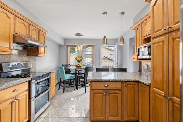 25 Glacier Dr, Smithtown, NY 11787 - kitchen featuring appliances with stainless steel finishes, under cabinet range hood, granite tiled floors, hanging light fixtures, and a peninsula