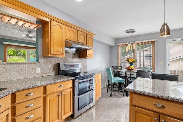 25 Glacier Dr, Smithtown, NY 11787 - kitchen with under cabinet range hood, range with two ovens, tasteful backsplash, and light stone counters