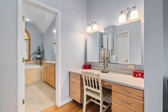 25 Glacier Dr, Smithtown, NY 11787 - bathroom featuring a bath, vanity, and vaulted ceiling