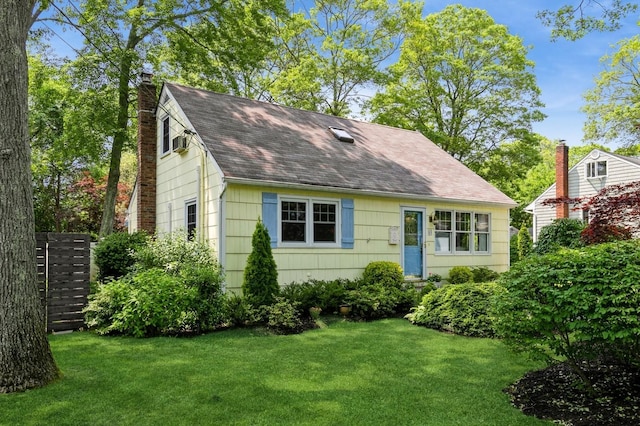 96 N Howells Point Rd, Bellport Village, NY 11713 - cape cod home featuring a chimney, a front lawn, and a shingled roof
