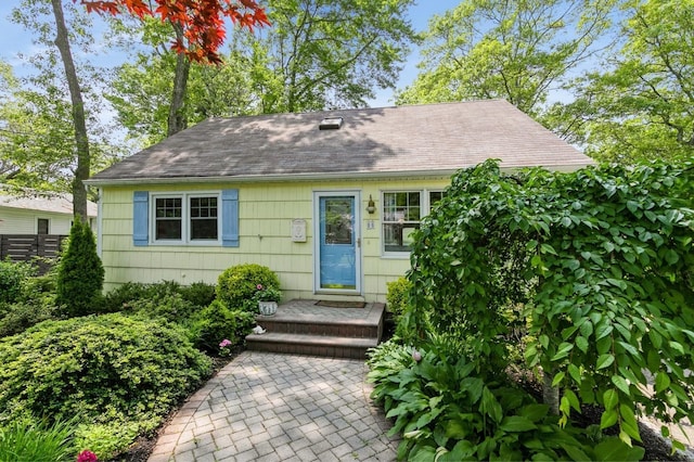 96 N Howells Point Rd, Bellport Village, NY 11713 - view of front of home with roof with shingles