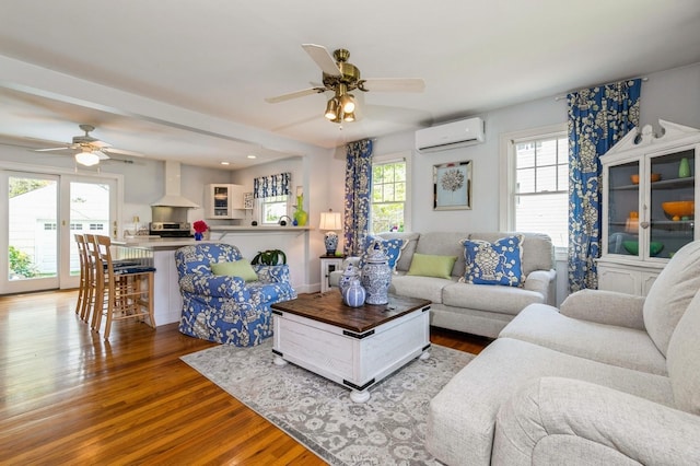 96 N Howells Point Rd, Bellport Village, NY 11713 - living area with a ceiling fan, a wall mounted AC, wood finished floors, and recessed lighting