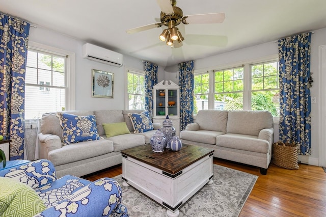 96 N Howells Point Rd, Bellport Village, NY 11713 - living room featuring a wall mounted AC, plenty of natural light, a ceiling fan, and wood finished floors