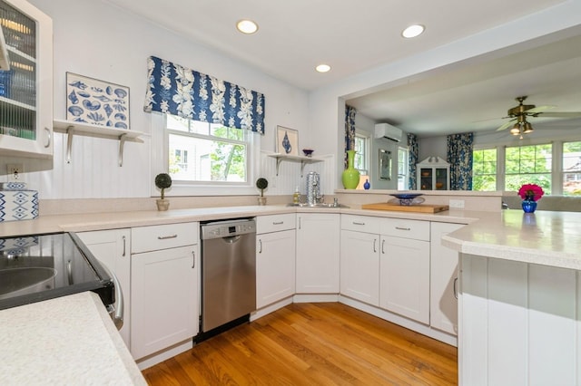 96 N Howells Point Rd, Bellport Village, NY 11713 - kitchen with stainless steel dishwasher, open shelves, a sink, light wood finished floors, and recessed lighting