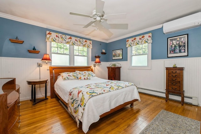96 N Howells Point Rd, Bellport Village, NY 11713 - bedroom with a wall unit AC, a wainscoted wall, a baseboard radiator, hardwood / wood-style floors, and ornamental molding