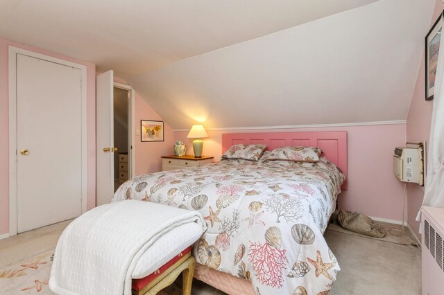 96 N Howells Point Rd, Bellport Village, NY 11713 - bedroom featuring carpet, vaulted ceiling, a wall unit AC, and baseboards
