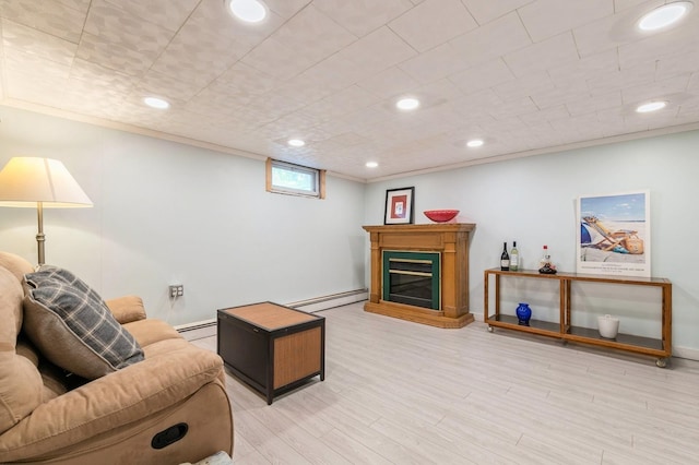 96 N Howells Point Rd, Bellport Village, NY 11713 - living room featuring a baseboard heating unit, baseboards, light wood-style flooring, recessed lighting, and a glass covered fireplace