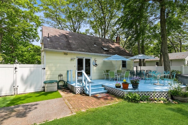 96 N Howells Point Rd, Bellport Village, NY 11713 - rear view of property featuring a deck, a gate, roof with shingles, and outdoor dining space