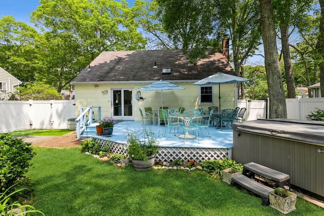 96 N Howells Point Rd, Bellport Village, NY 11713 - back of house with a hot tub, a deck, a chimney, outdoor dining space, and a shingled roof