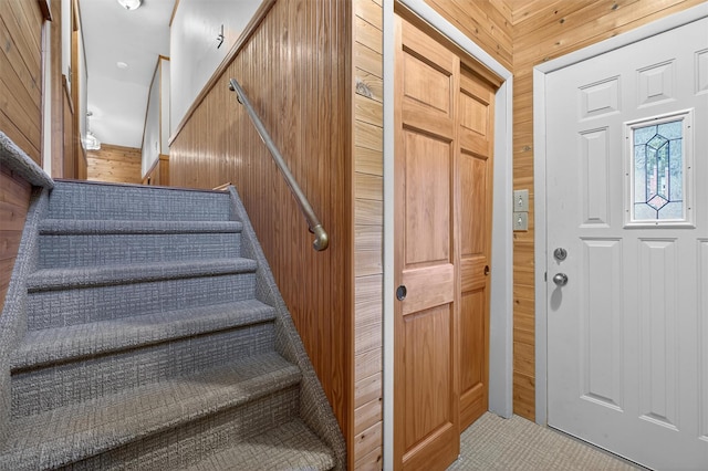 69 Crafts Rd, Carmel, NY 10512 - foyer entrance featuring wood walls and stairway