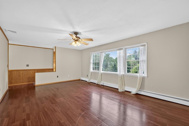 69 Crafts Rd, Carmel, NY 10512 - empty room featuring ceiling fan, wood finished floors, and a baseboard heating unit