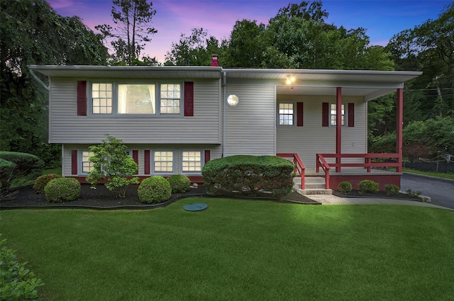69 Crafts Rd, Carmel, NY 10512 - view of front facade with a porch and a yard