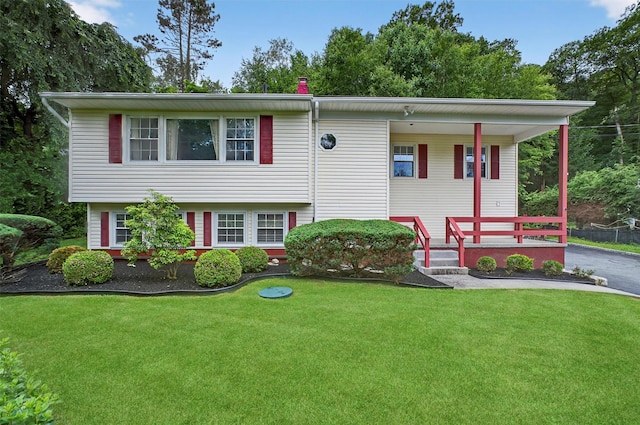 69 Crafts Rd, Carmel, NY 10512 - view of front of home with covered porch and a front lawn