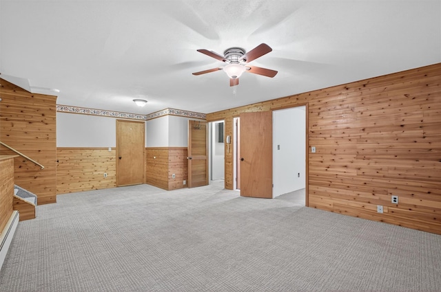 69 Crafts Rd, Carmel, NY 10512 - unfurnished bedroom with wooden walls, light colored carpet, and ceiling fan
