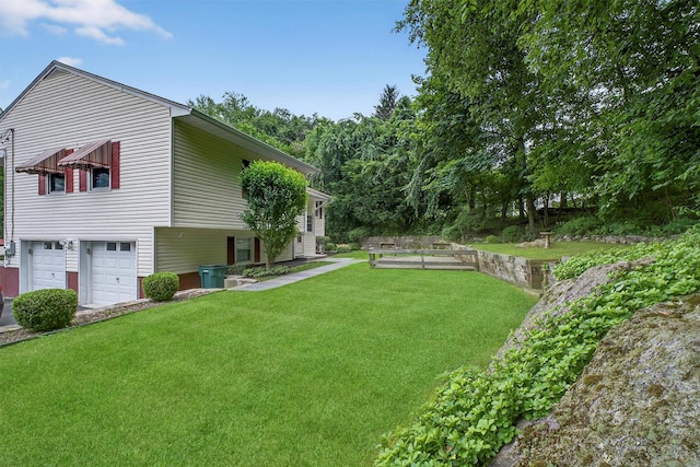 69 Crafts Rd, Carmel, NY 10512 - view of green lawn with an attached garage
