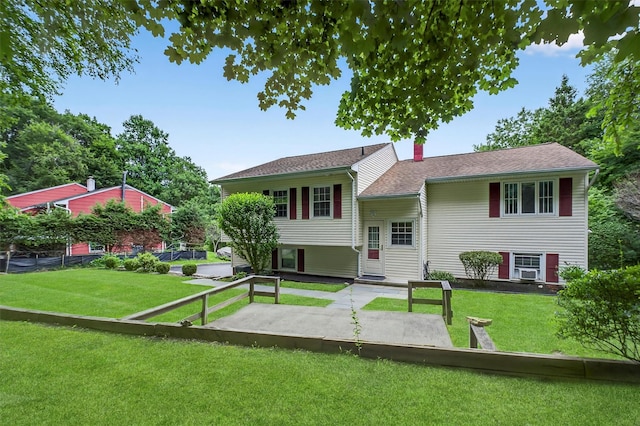 69 Crafts Rd, Carmel, NY 10512 - view of front of home with a front lawn, a patio, and a chimney