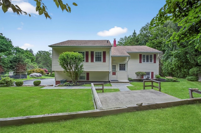69 Crafts Rd, Carmel, NY 10512 - view of front of home featuring a front lawn, a patio area, and a chimney