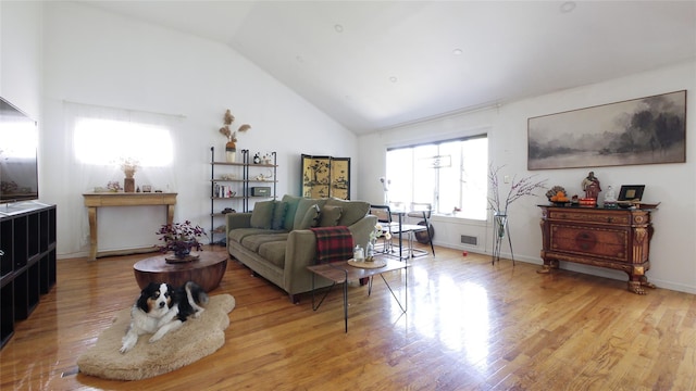 1651 201st St, Bayside, NY 11360 - living room featuring light wood-type flooring and high vaulted ceiling
