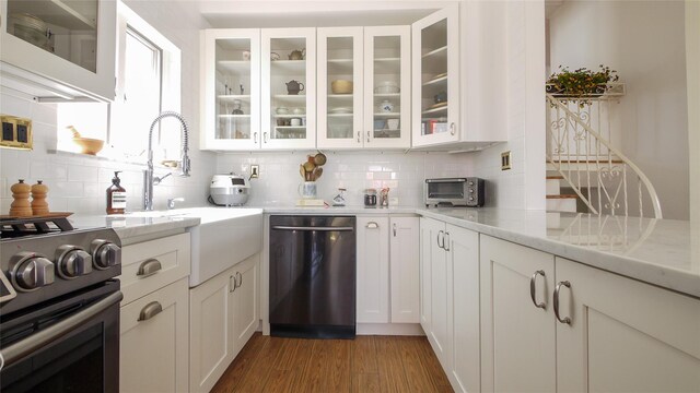 1651 201st St, Bayside, NY 11360 - kitchen featuring dishwashing machine, stainless steel range, a sink, and backsplash
