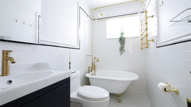 1651 201st St, Bayside, NY 11360 - bathroom with tile walls, a soaking tub, toilet, vanity, and tile patterned flooring