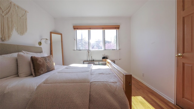 1651 201st St, Bayside, NY 11360 - bedroom featuring light wood-type flooring and baseboards
