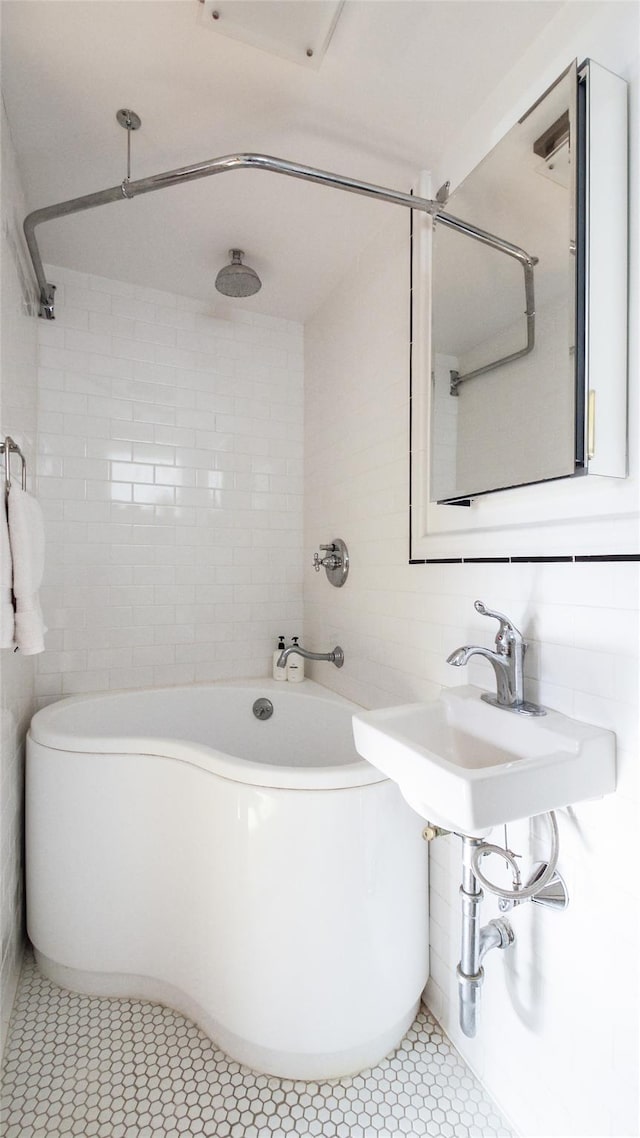 1651 201st St, Bayside, NY 11360 - bathroom with tile walls, tile patterned floors, and a combined bath / shower with rainfall shower