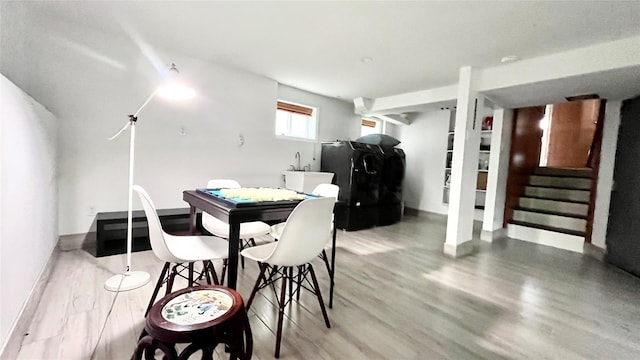 1651 201st St, Bayside, NY 11360 - dining area with light wood-type flooring, washer / clothes dryer, and stairs