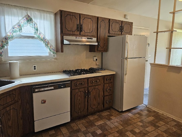 209 Loop Dr, Sayville, NY 11782 - kitchen featuring white appliances, under cabinet range hood, light countertops, and brick patterned flooring