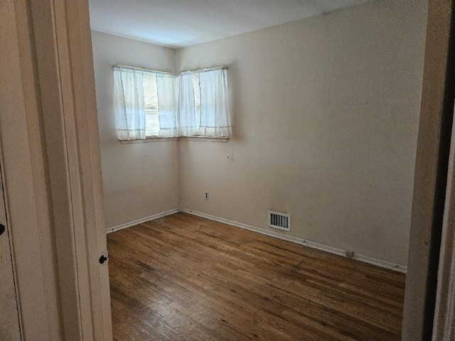 209 Loop Dr, Sayville, NY 11782 - spare room with wood finished floors and baseboards
