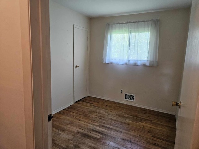 209 Loop Dr, Sayville, NY 11782 - unfurnished bedroom with wood finished floors and baseboards