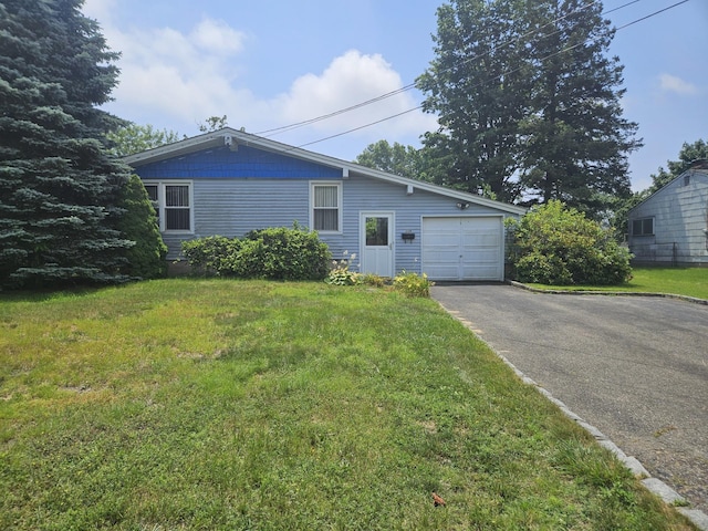 209 Loop Dr, Sayville, NY 11782 - view of front of house with asphalt driveway and a front yard