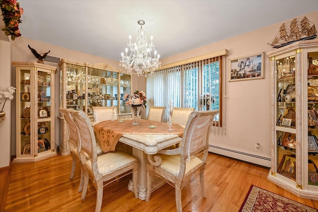 4539 192nd St, Flushing, NY 11358 - dining area featuring a baseboard heating unit, a chandelier, and light wood-type flooring