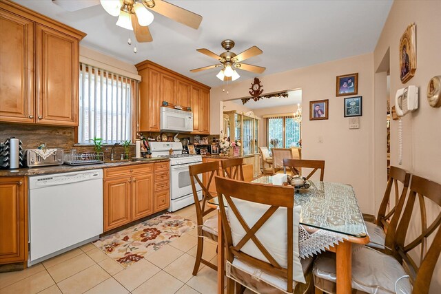4539 192nd St, Flushing, NY 11358 - kitchen featuring white appliances, a ceiling fan, tasteful backsplash, and healthy amount of natural light
