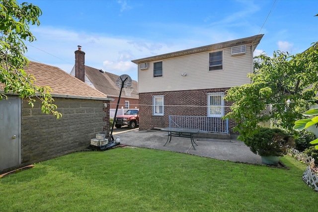 4539 192nd St, Flushing, NY 11358 - back of house with brick siding, a yard, and a patio