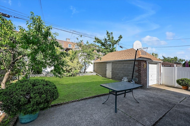 4539 192nd St, Flushing, NY 11358 - view of yard with an outbuilding, driveway, and a detached garage