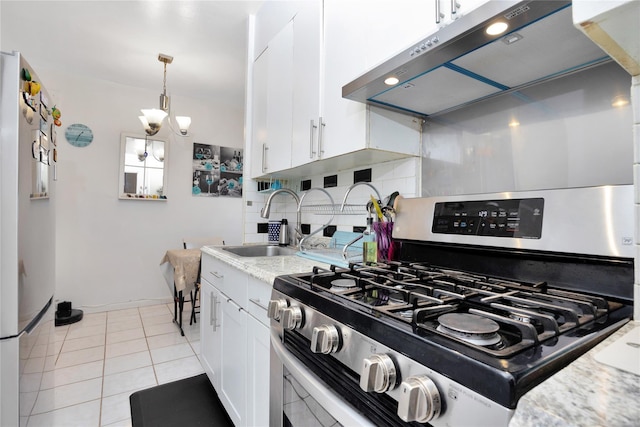99-40 63rd Rd Unit 9Z, Rego Park, NY 11374 - kitchen with stainless steel range with gas stovetop, exhaust hood, tasteful backsplash, white cabinets, and freestanding refrigerator
