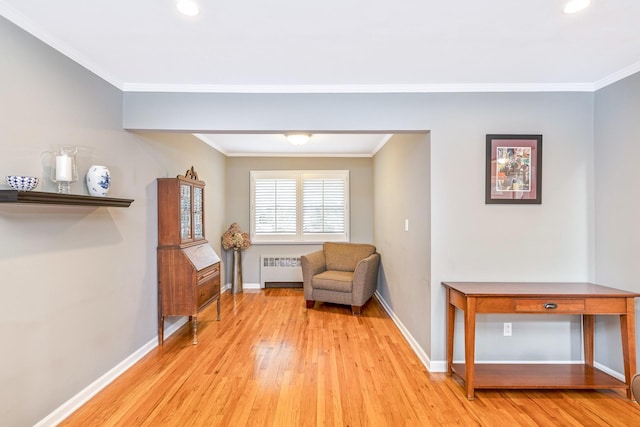 7 Dawn Dr, East Northport, NY 11731 - sitting room with radiator heating unit, light wood-type flooring, crown molding, baseboards, and recessed lighting