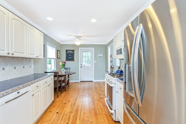 7 Dawn Dr, East Northport, NY 11731 - kitchen featuring white appliances, ceiling fan, light wood-style floors, tasteful backsplash, and crown molding