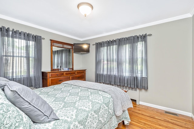 7 Dawn Dr, East Northport, NY 11731 - bedroom featuring crown molding, wood finished floors, and baseboards