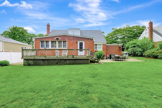 7 Dawn Dr, East Northport, NY 11731 - rear view of property featuring a wooden deck, brick siding, a patio, and a chimney
