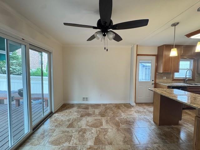 20817 15th Rd, Bayside, NY 11360 - kitchen featuring a sink, healthy amount of natural light, ceiling fan, baseboards, and ornamental molding