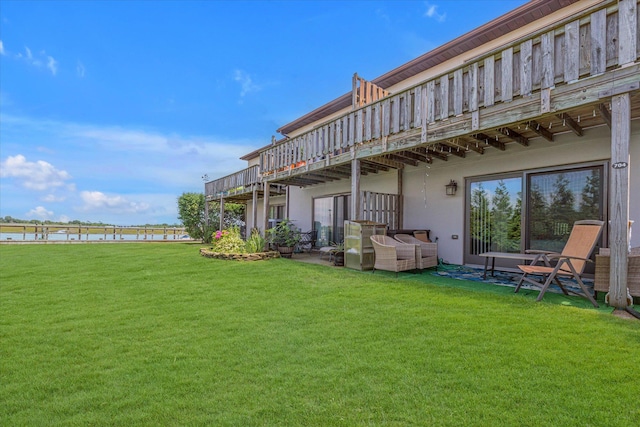 1 Anchorage Way Unit 704, Freeport, NY 11520 - view of green lawn featuring a deck with water view