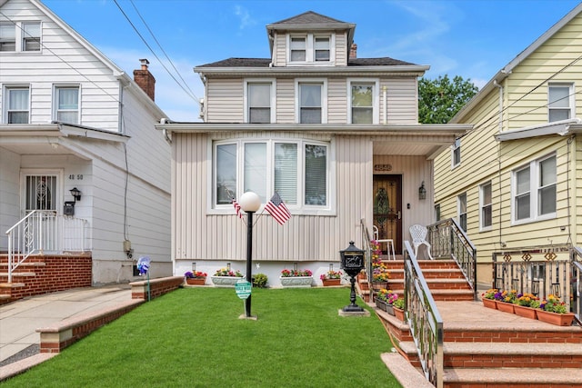 48-46 206th St Unit 2, Bayside, NY 11364 - traditional style home featuring a front lawn, board and batten siding, and a shingled roof