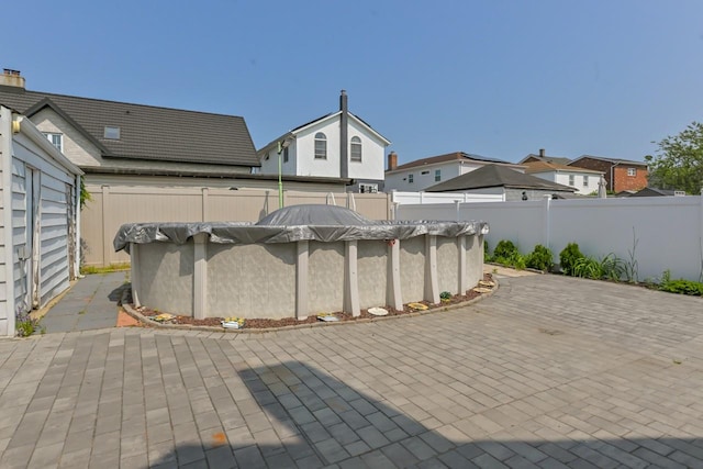162-29 95th St, Howard Beach, NY 11414 - fenced backyard with a patio and a residential view