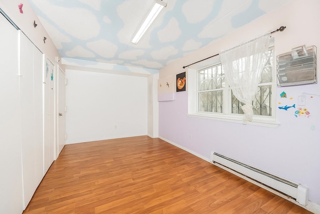 1321 Lafayette Ave, Bronx, NY 10474 - corridor with a baseboard heating unit and wood finished floors
